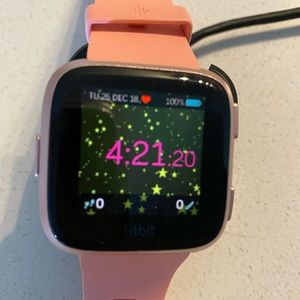 Fitbit Versa with Peach Color Band